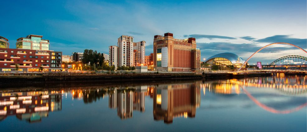 Panorama of Newcastle upon Tyne from waterfront at dusk